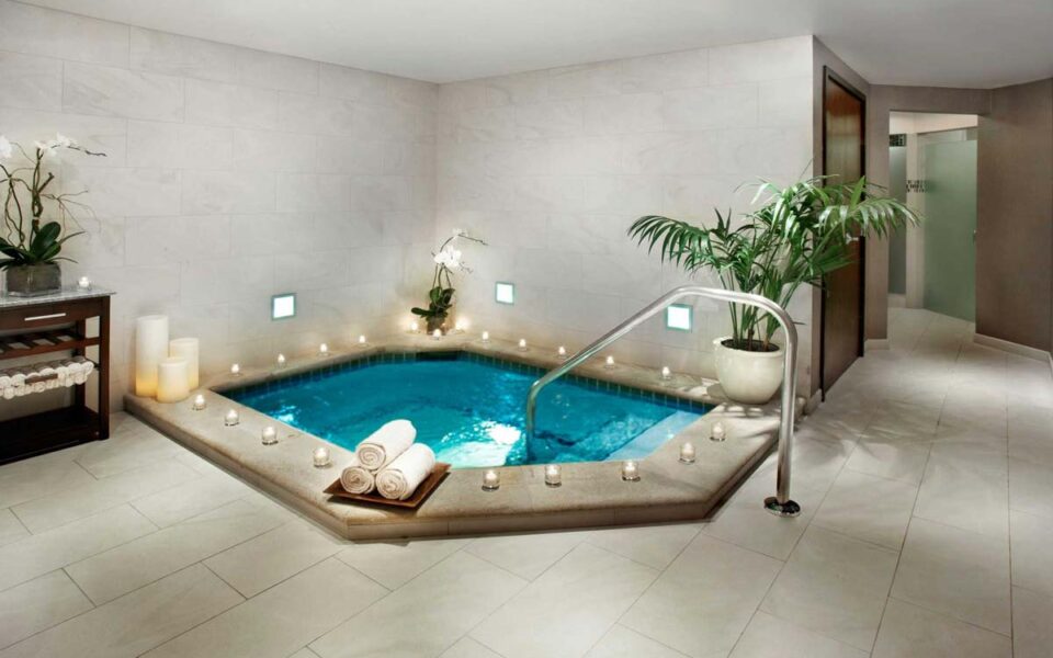 spa hot tub with candles surrounding the exterior